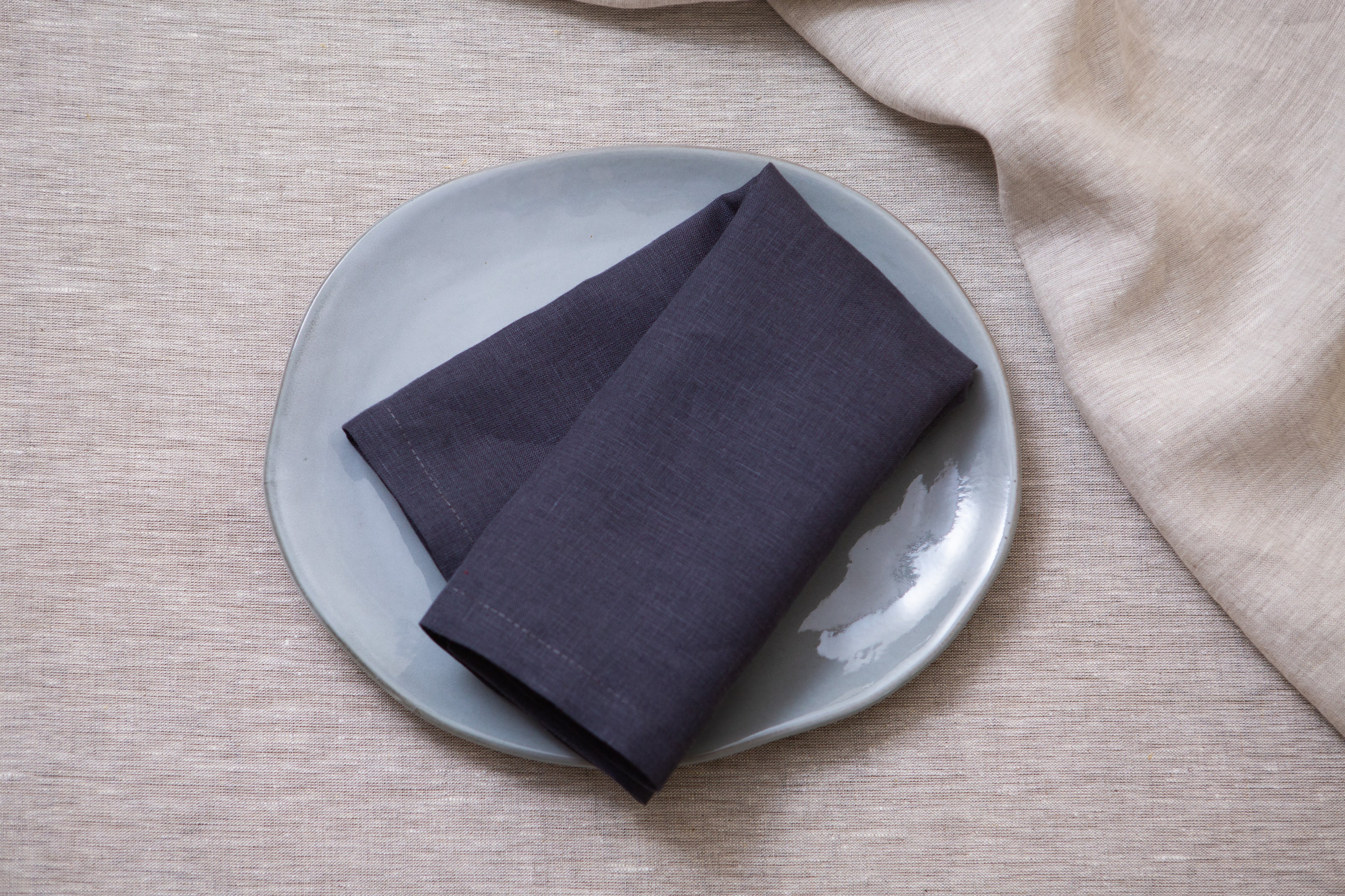 Sustainable slate linen napkins: eco-friendly, washable, and perfect for any meal or event. Wholesale custom orders.