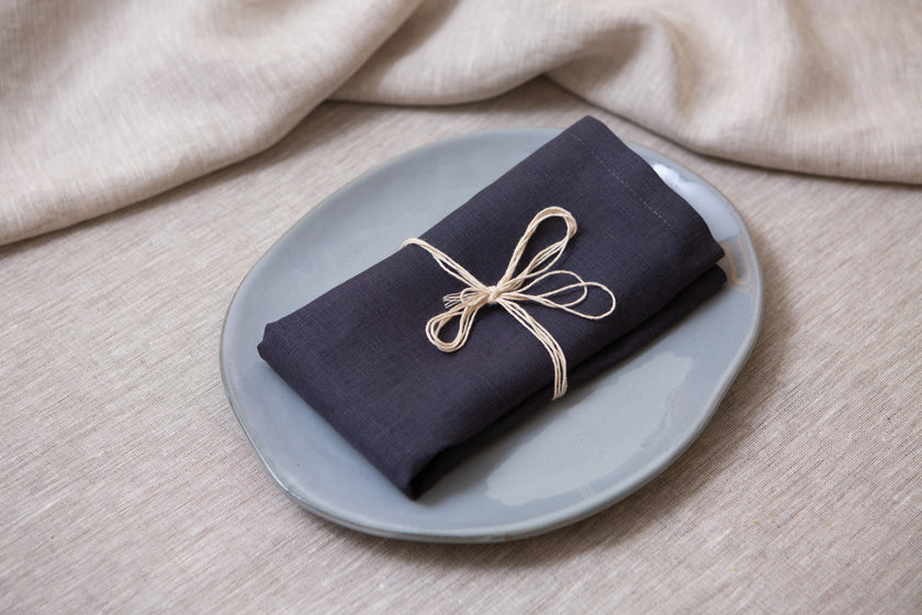 Slate grey organic linen napkins with mitered corners. Sustainable, reusable, and perfect for dinner, lunch, or cocktails. Wholesales, bulk custom order.