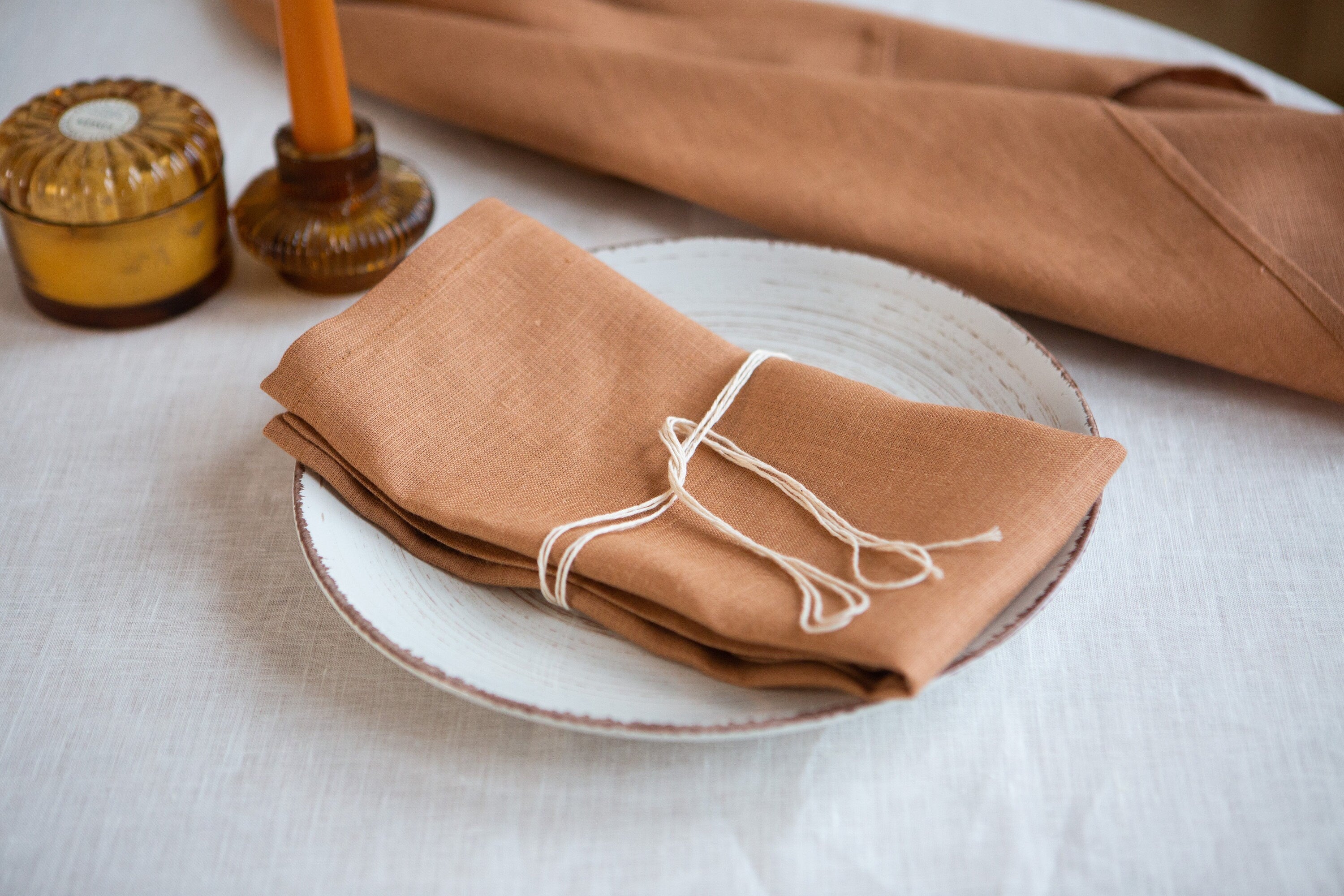 Organic linen napkins in a serene sandstone color. Crafted from premium sustainable materials. Eco-friendly linen dinning. Perfect for any occasion. Easy to care for and long-lasting.