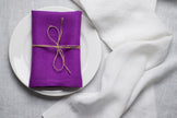 Violet linen napkin close-up showing the natural organic linen texture