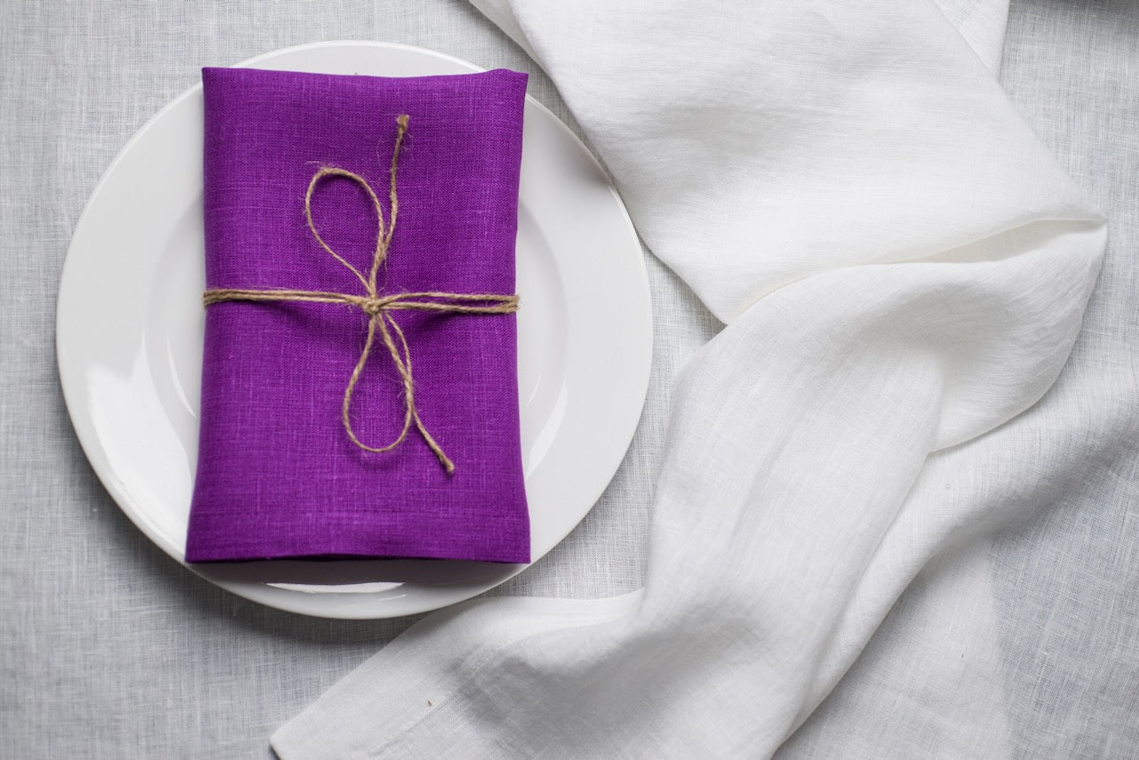 Violet linen napkin close-up showing the natural organic linen texture