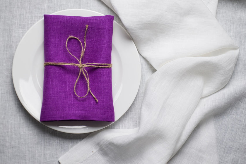 Violet linen napkin close-up showing the natural organic linen texture