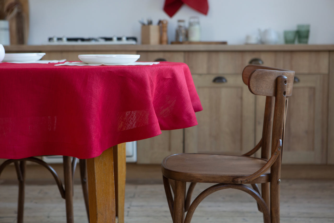 Classic red organic linen tablecloth, perfect for elegant dining, made from 100% eco-friendly linen, showcasing a timeless design for any occasion.