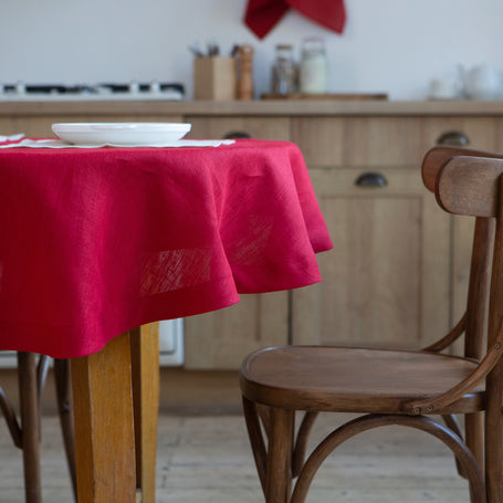 Classic red organic linen tablecloth, perfect for elegant dining, made from 100% eco-friendly linen, showcasing a timeless design for any occasion.