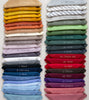 A palette of linen towels in various shades from the organic textile brand Coollinen.