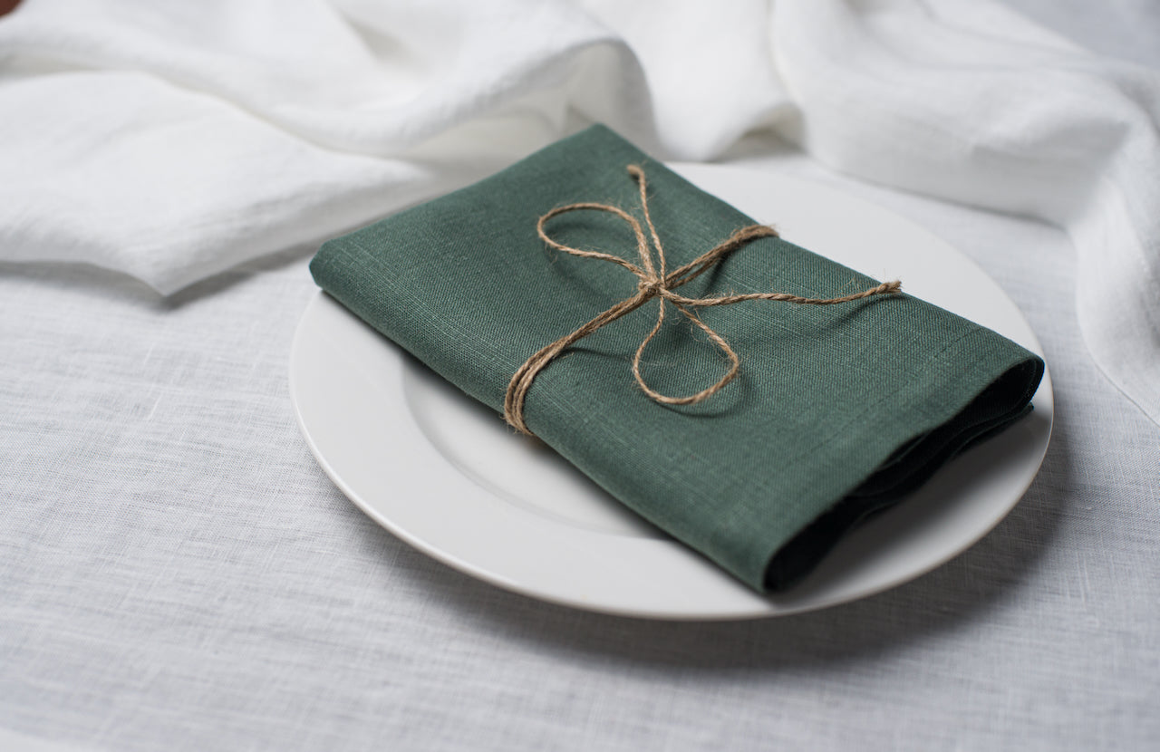 Green basil linen dinner napkin with elegant mitered corners, soft natural flax fabric for wedding table setting and home decor