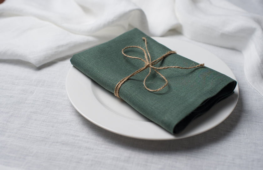 Green basil linen dinner napkin with elegant mitered corners, soft natural flax fabric for wedding table setting and home decor