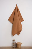 The sandstone-colored natural linen towel