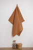 The sandstone-colored natural linen towel