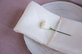 Elegant white organic linen napkins: washable, eco-friendly, and reusable for all occasions—lunch, dinner, or cocktails.