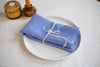 Cornflower blue organic linen napkins: OEKO-TEX certified, zero-waste, and perfect for creating a cozy, natural dining experience.