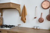 Honey linen kitchen towel in a rustic kitchen – warm harvest color