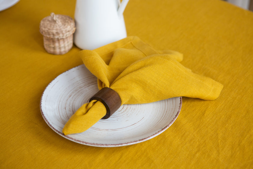 Vibrant mustard linen napkins – the perfect gift for special occasions like Thanksgiving, Christmas, or New Year's, offering a chic, zero-waste dining experience.