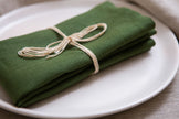 Lush green organic linen napkins with mitered corners—sophisticated, reusable, and eco-friendly. Perfect for festive occasions like Mother’s Day brunch or a warm Christmas dinner. A timeless gift for a sustainable home.