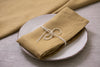 Elegant honey organic linen napkins – crafted with care for a sustainable and stylish dining experience, perfect for any occasion or festive dinner.