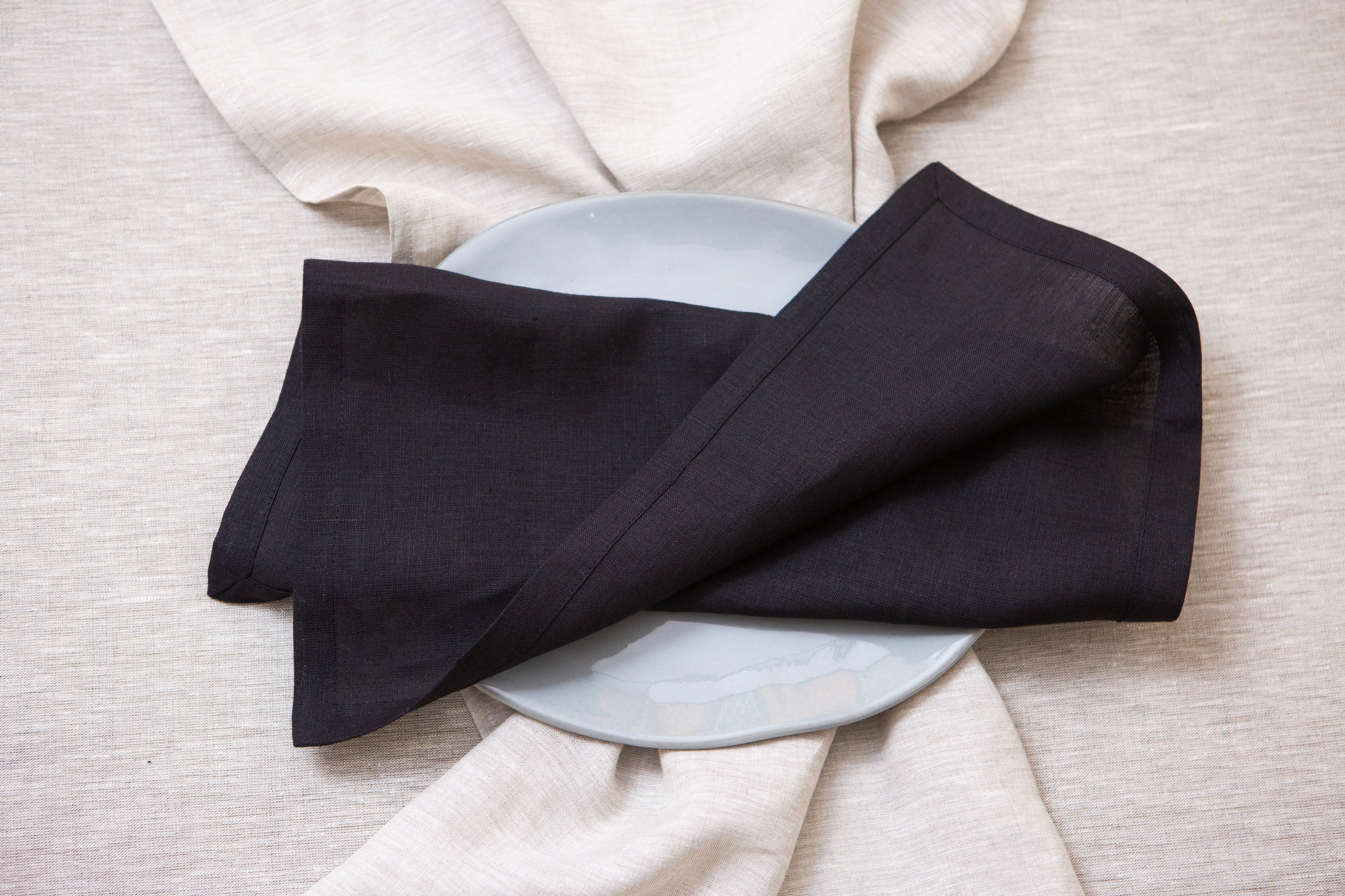 Black organic linen napkins: eco-friendly, zero-waste, washable, and stylish for any table decor.