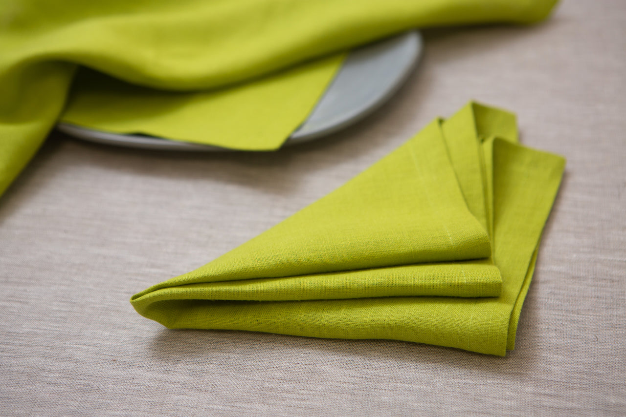 Add a pop of energy to your table with lime-colored organic linen napkins. The vibrant hue uplifts moods and creates a lively atmosphere, making every meal a joyful experience. Embrace the refreshing influence of lime with these vibrant napkins, adding a burst of color to your dining space.