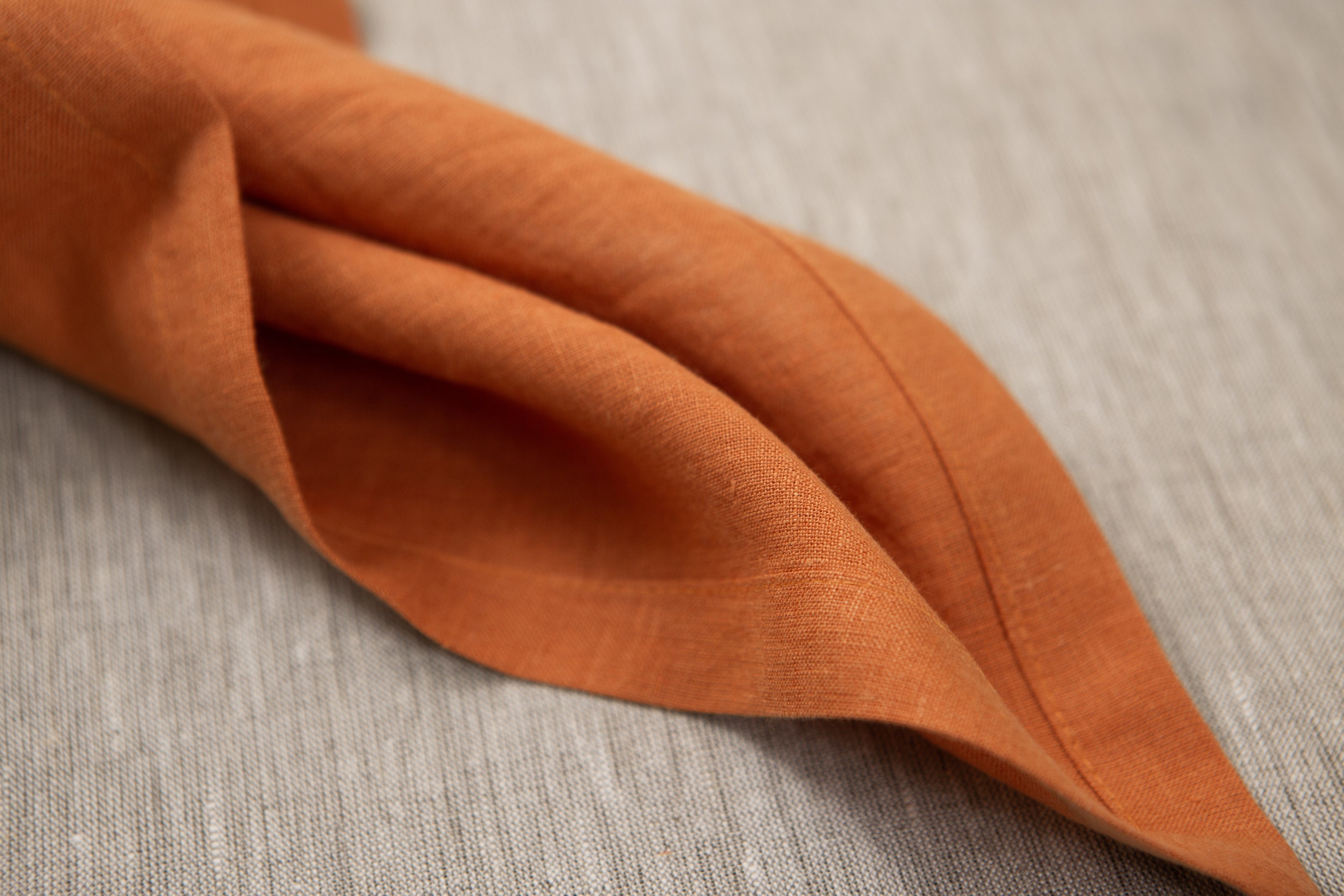 Terracotta organic linen napkins: OEKO-TEX certified, zero-waste, and perfect for creating a warm, natural dining experience. Perfect linen gift.