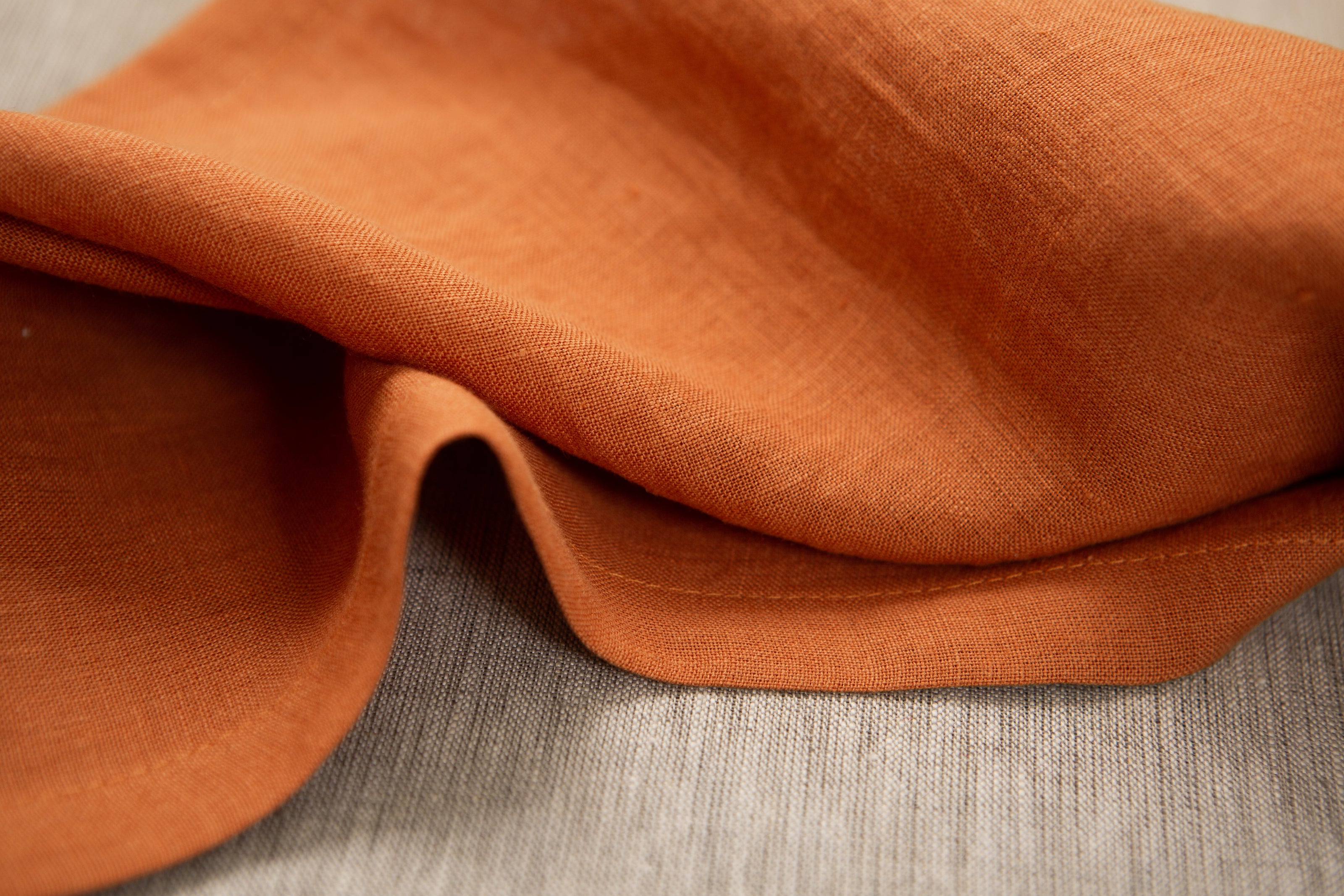 Earthy terracotta organic linen napkins: washable, reusable, and eco-friendly—ideal for lunch, dinner, or cocktails. Perfect linen gift.