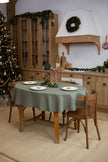 Sage linen tablecloth on a round table