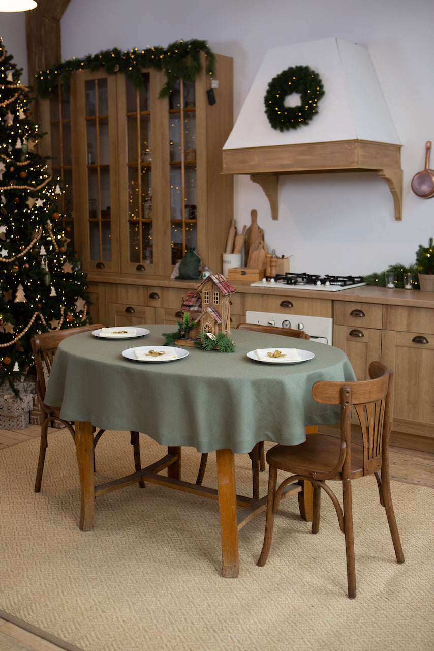 Sage linen tablecloth on a round table