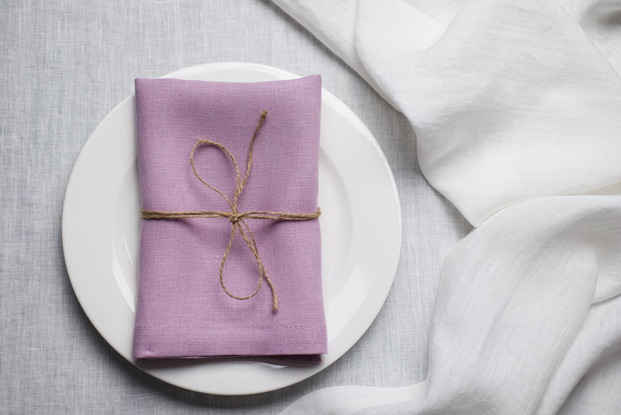 Lavender organic linen napkin styled for Easter celebration with a soft pastel aesthetic. The delicate purple shade enhances spring table decor and festive gatherings. Made from sustainable linen for elegant and eco-friendly hosting.