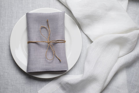 Light grey organic linen napkin arranged for a refined Easter table setting. The subtle neutral shade balances pastel florals and white ceramics for modern spring decor. Crafted from eco-friendly natural linen for sophisticated and sustainable entertaining.