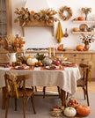 Terracotta linen placemats and napkins on a Thanksgiving dinner table with a natural linen tablecloth, pumpkins and candles – CoolLinen