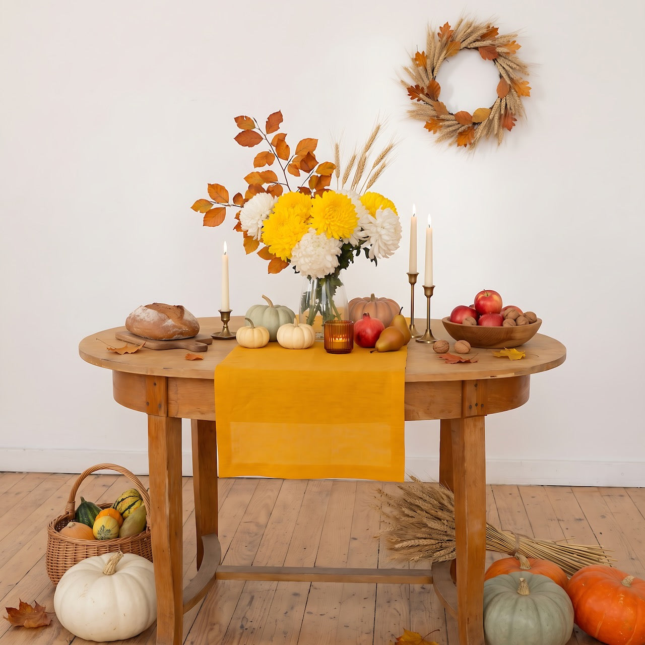 Mustard linen table runner on a wooden table with pumpkins, candles and yellow chrysanthemums – Thanksgiving table decor – CoolLinen