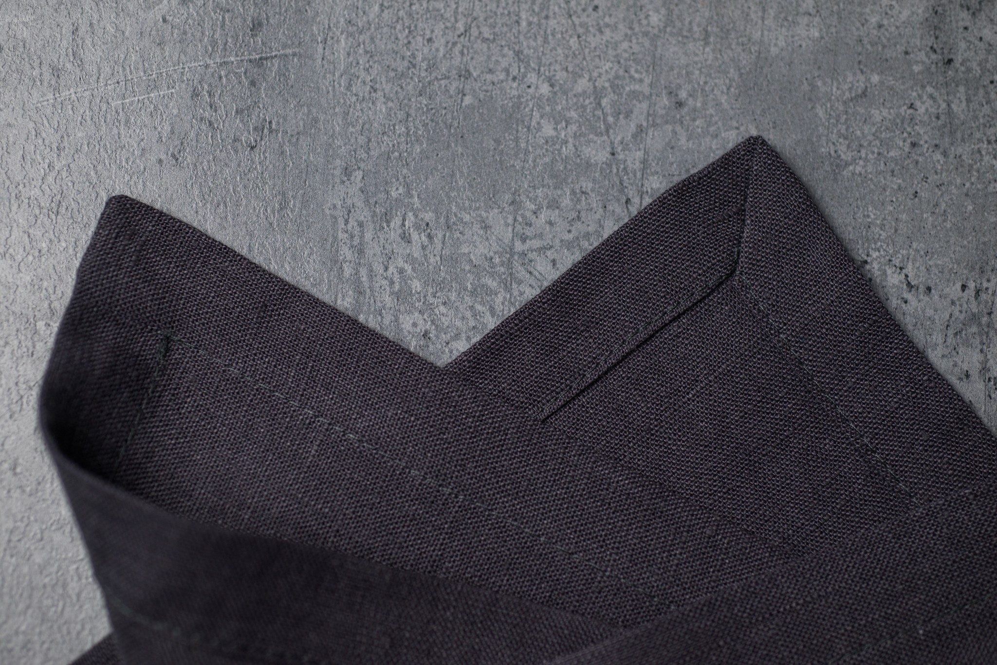 Slate linen fabric close-up with mitered hem corner – CoolLinen color 2. Slate