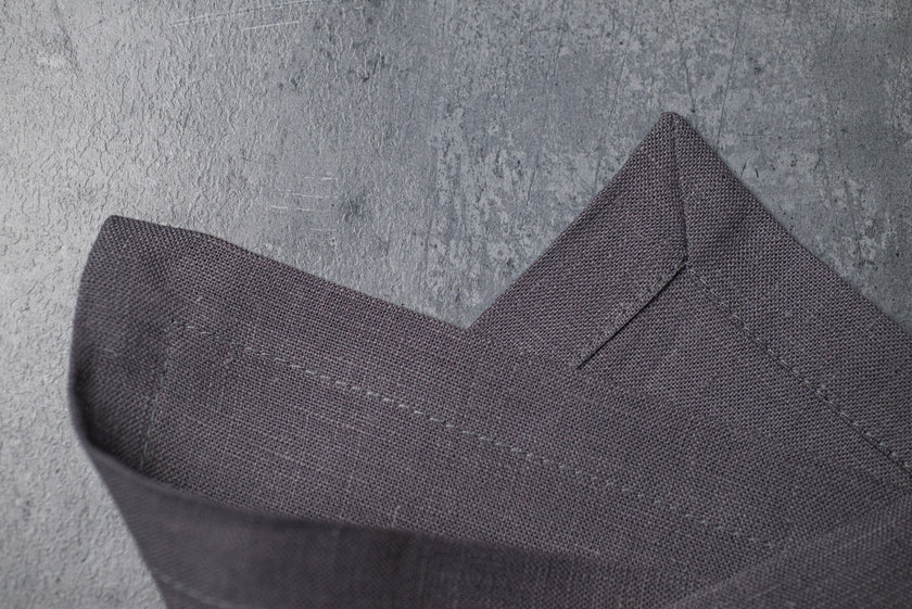 Grey linen fabric close-up with mitered hem corner – CoolLinen color 3. Grey