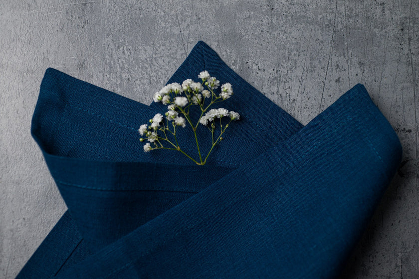 Blue linen fabric close-up with mitered hem corner – CoolLinen color 9. Blue
