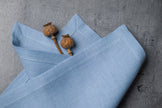 Sky linen fabric close-up with mitered hem corner – CoolLinen color 13. Sky