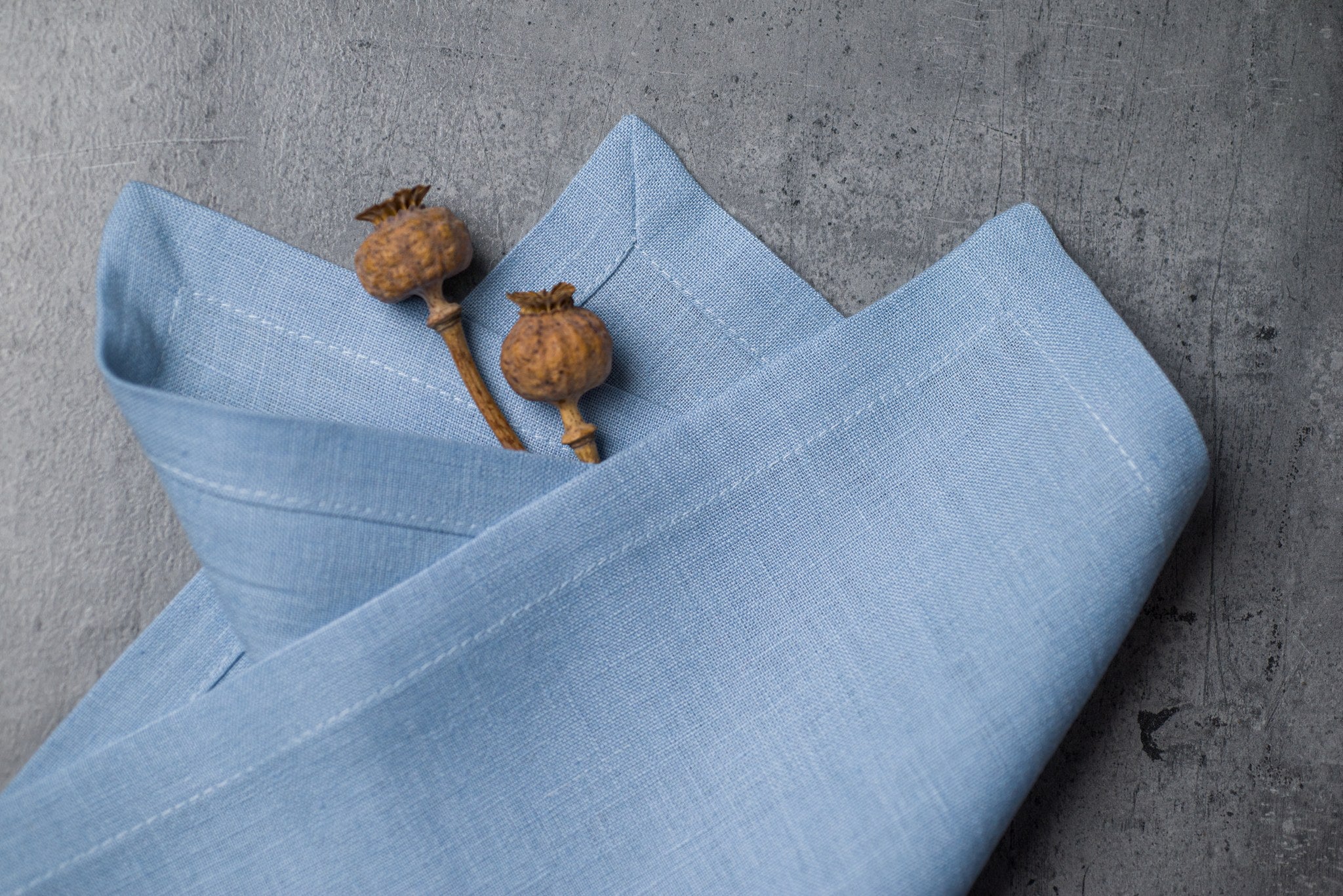 Sky linen fabric close-up with mitered hem corner – CoolLinen color 13. Sky