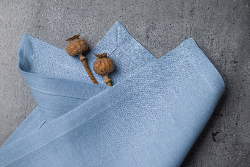 Sky linen fabric close-up with mitered hem corner – CoolLinen color 13. Sky