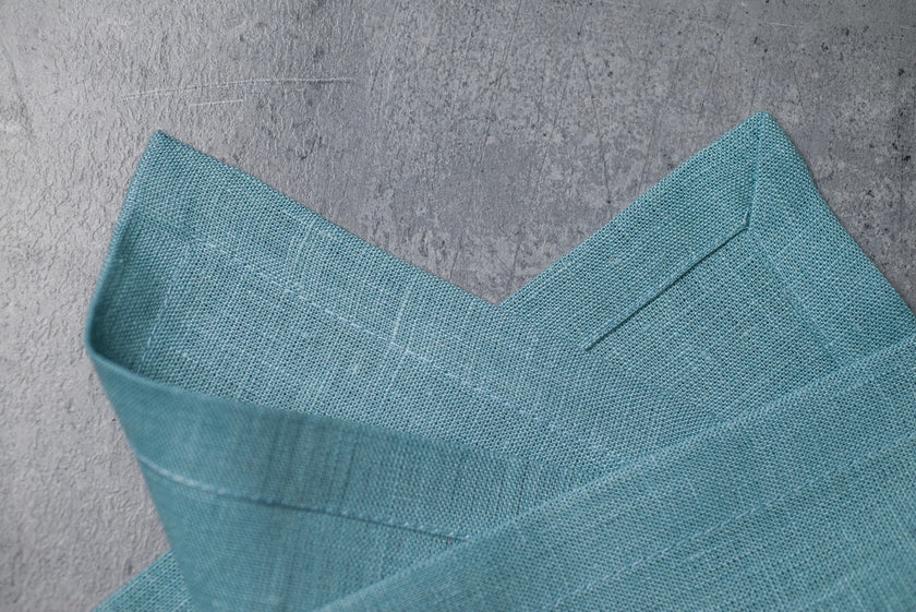 Teal linen fabric close-up with mitered hem corner – CoolLinen color Teal