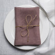 Limed Oak linen napkin tied with jute twine on a white plate