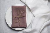 Limed Oak linen napkin tied with jute twine on a white plate