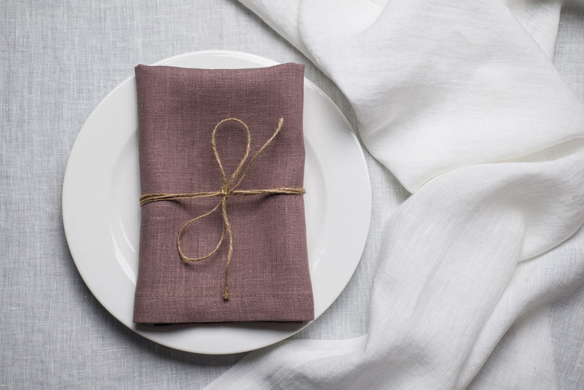 Limed Oak linen napkin tied with jute twine on a white plate