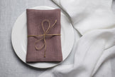 Limed Oak linen napkin tied with jute twine on a white plate