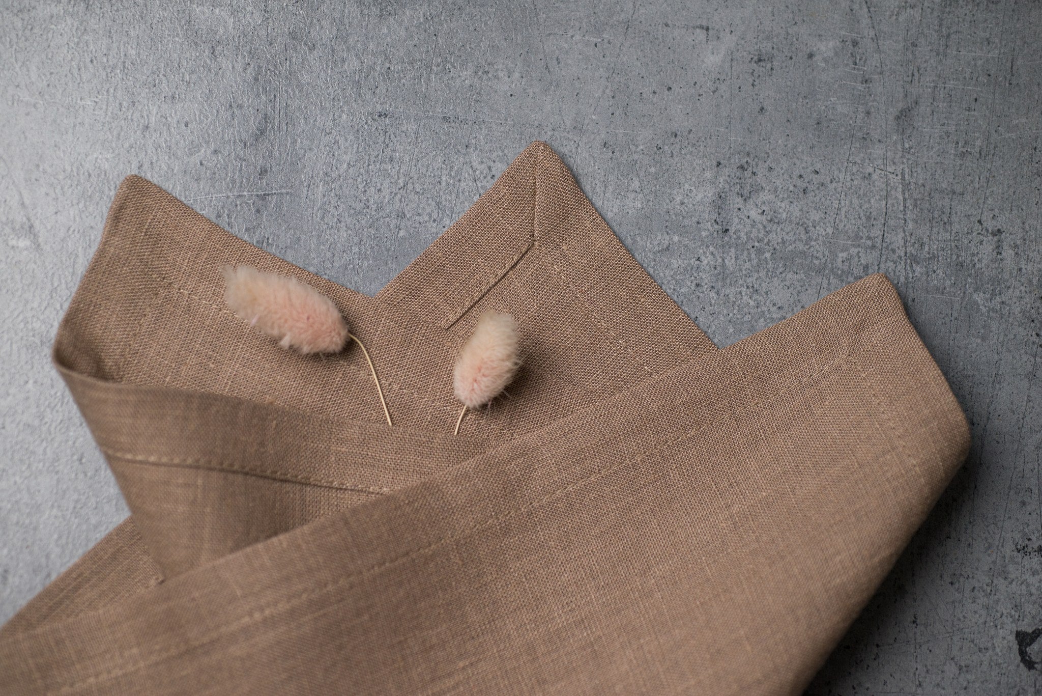 Oat linen fabric close-up with mitered hem corner – CoolLinen color 18. Oat