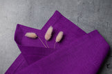 Violet linen fabric close-up with mitered hem corner – CoolLinen color 22. Violet