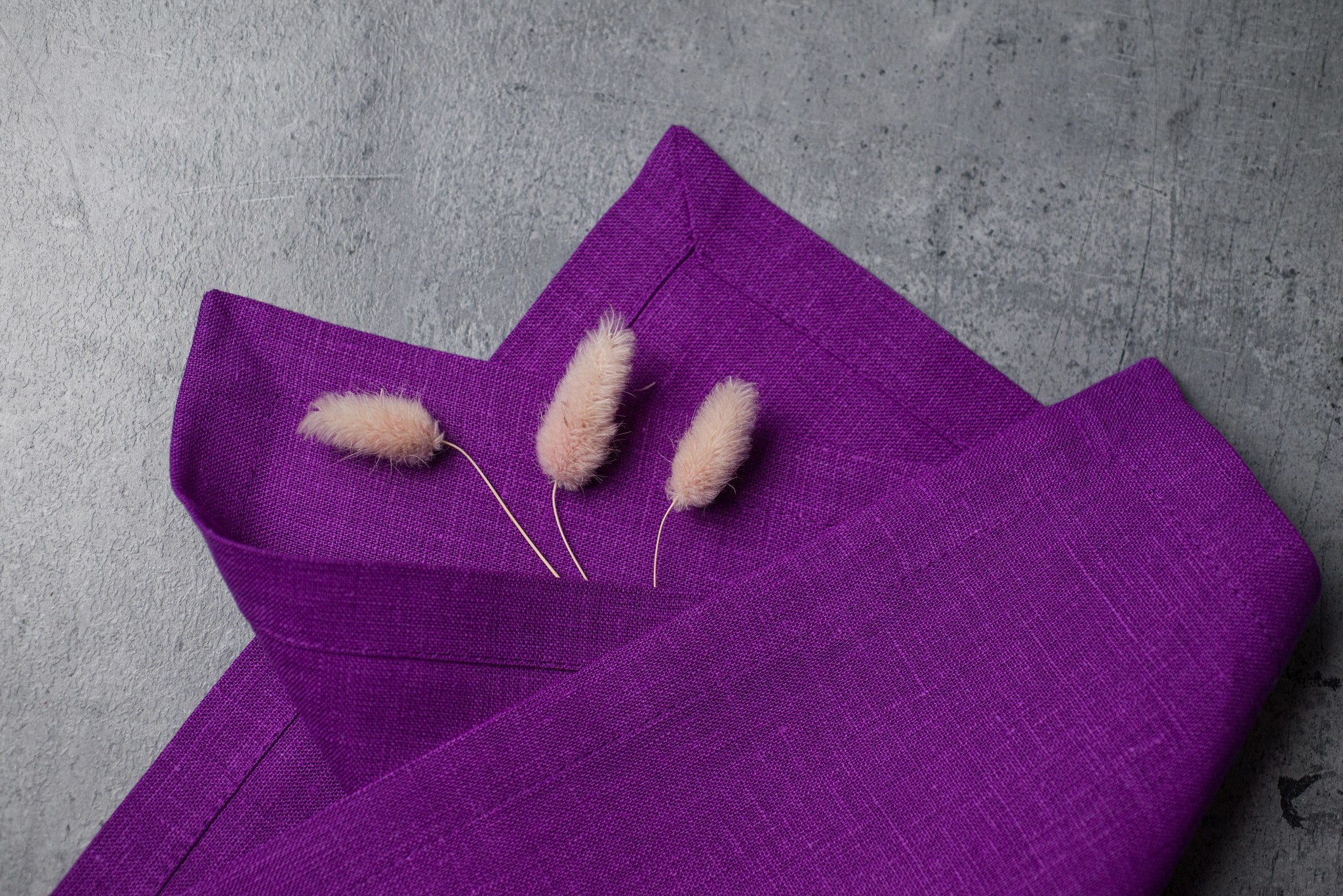 Violet linen fabric close-up with mitered hem corner – CoolLinen color 22. Violet