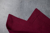 Plum linen fabric close-up with mitered hem corner – CoolLinen color 23. Plum