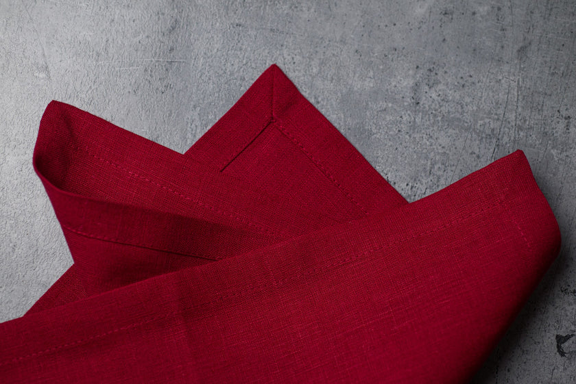 Wine linen fabric close-up with mitered hem corner – CoolLinen color 25. Wine