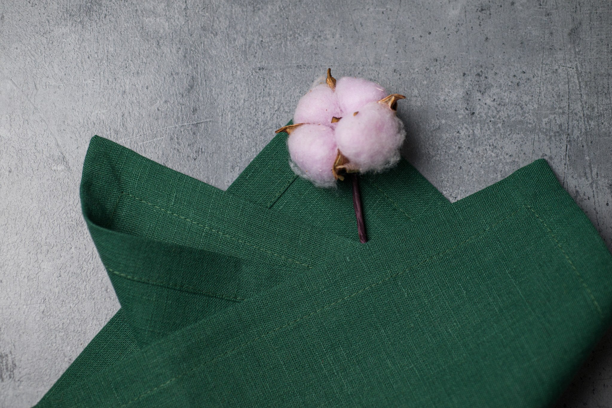 Hunter linen fabric close-up with mitered hem corner – CoolLinen color 33. Hunter