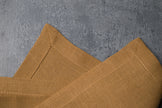 Honey linen fabric close-up with mitered hem corner – CoolLinen color 38. Honey