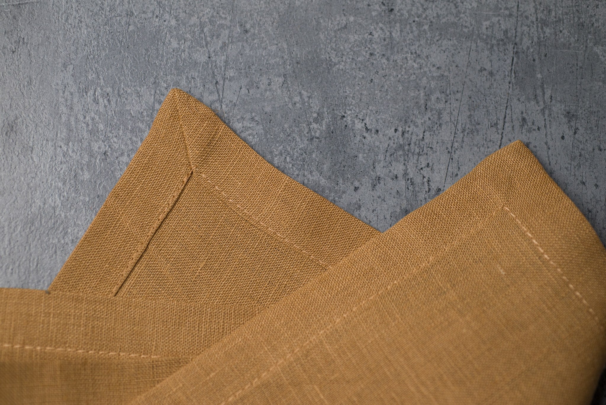 Honey linen fabric close-up with mitered hem corner – CoolLinen color 38. Honey