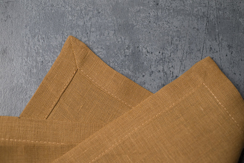 Honey linen fabric close-up with mitered hem corner – CoolLinen color 38. Honey