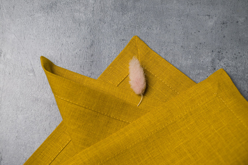 Corn linen fabric close-up with mitered hem corner – CoolLinen color 41. Corn